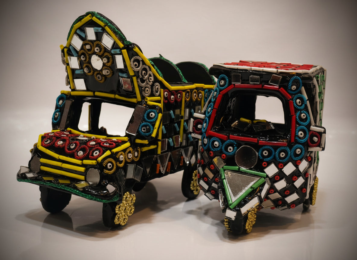 Decorative models of traditional Indian autorickshaws on a plain background