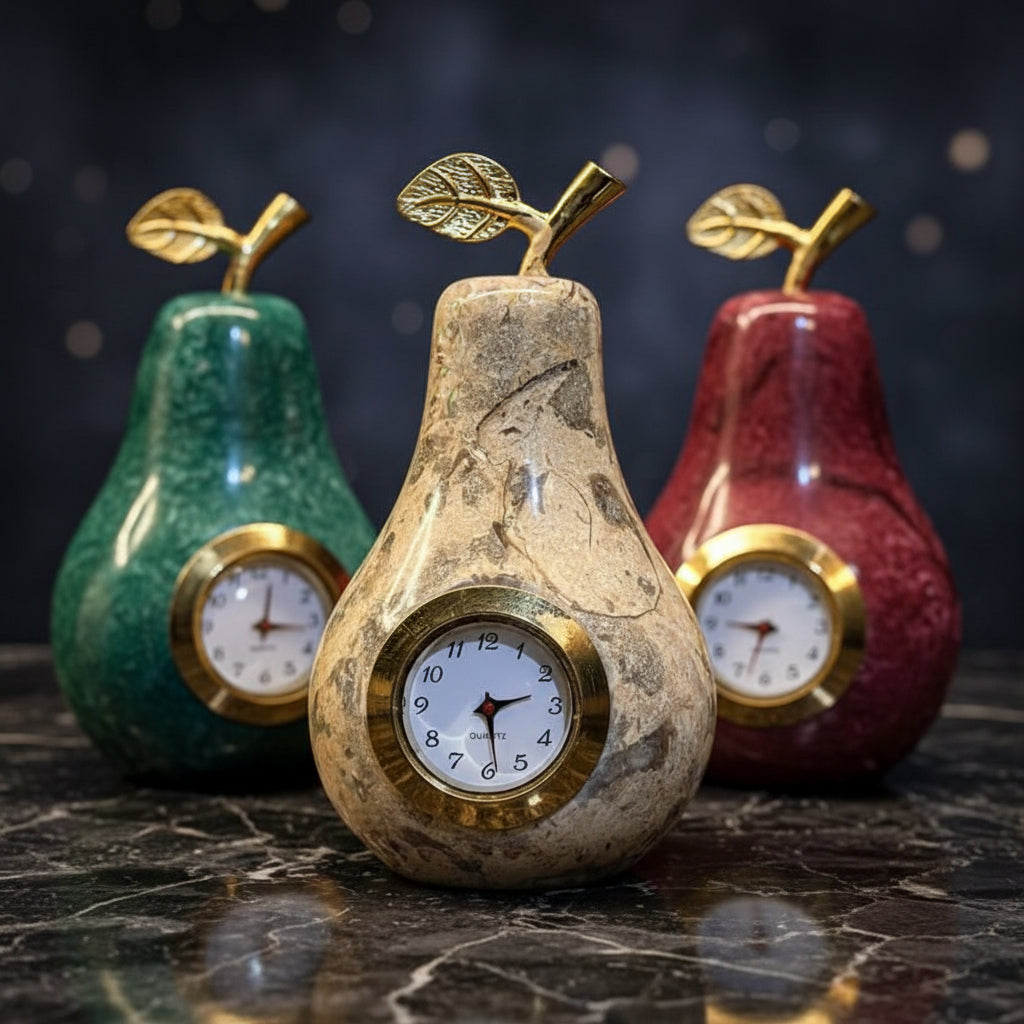 Decorative pear-shaped clocks with gold accents on a white background
